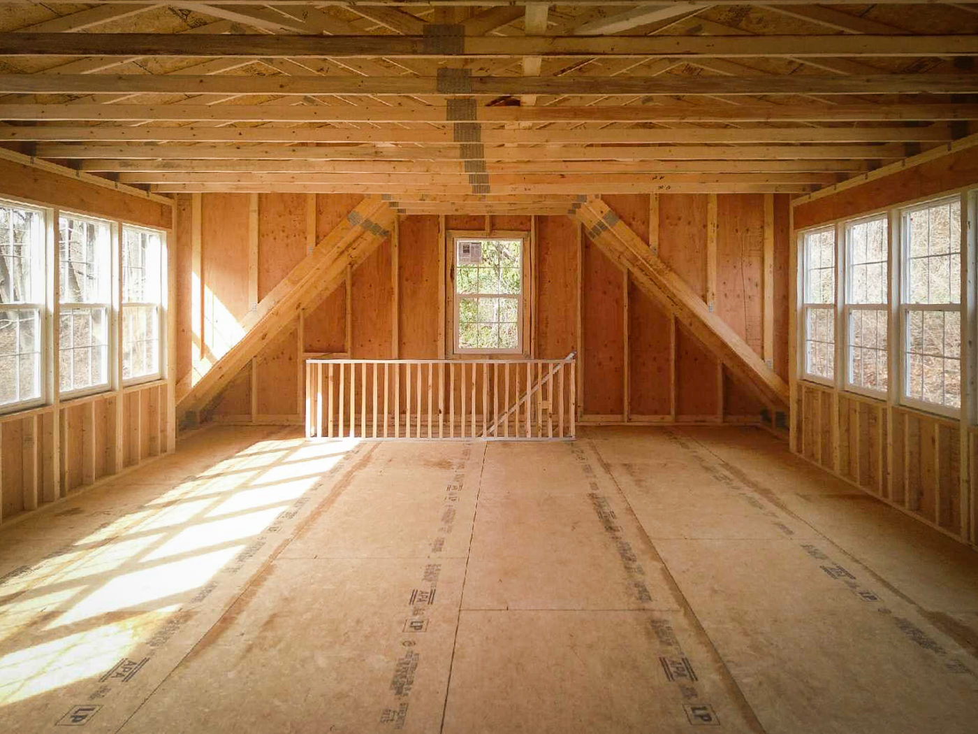 Interior of three car garage for sale with a second story